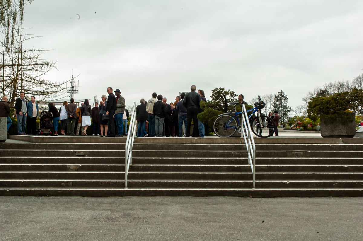 Musicians gathering at the top of the steps at Queen Elizabeth Park