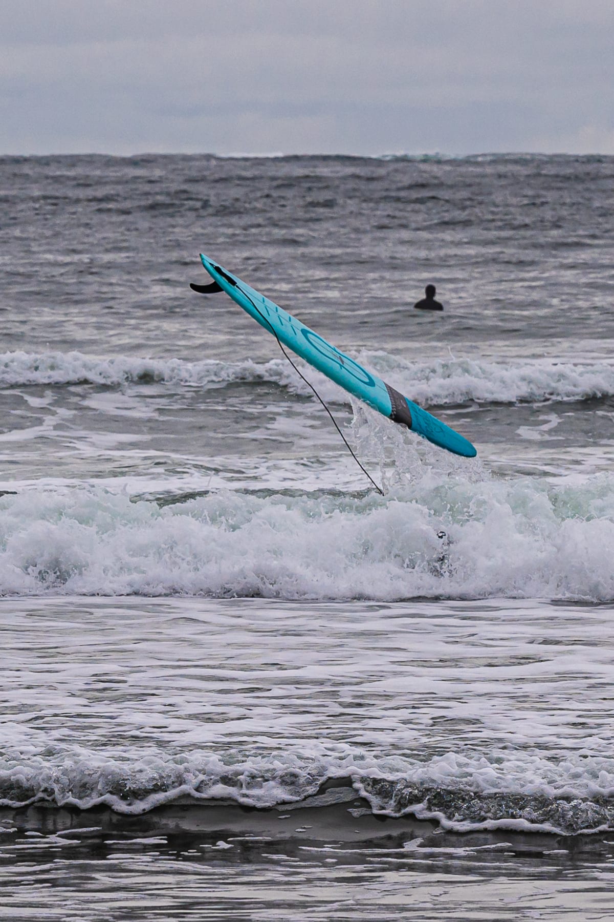 Surfers in the whitewash