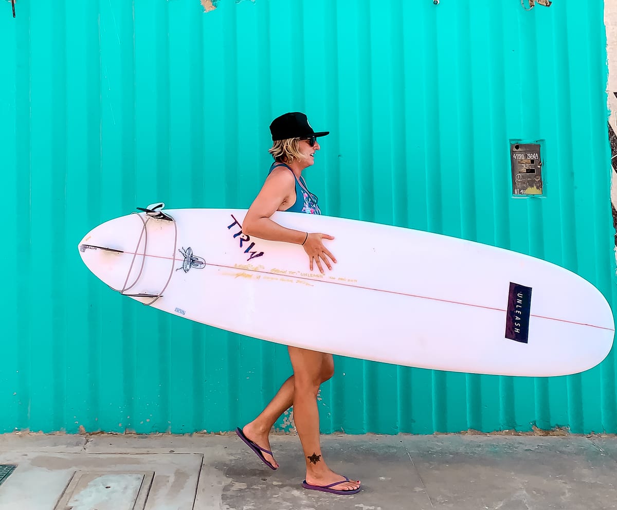 Wifey walking her surf board